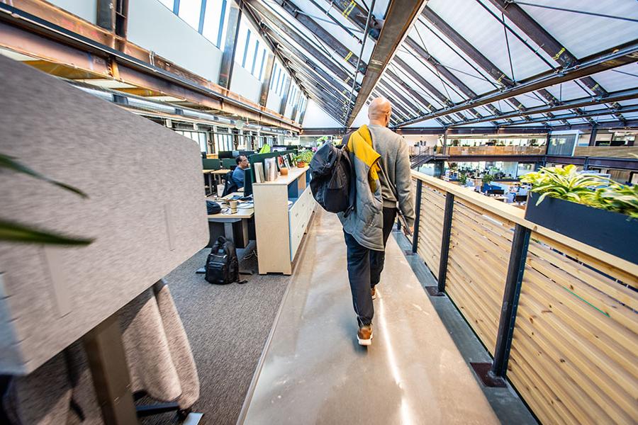 Bilal Clarance walks to his workstation between meetings at one of Google’s office buildings.