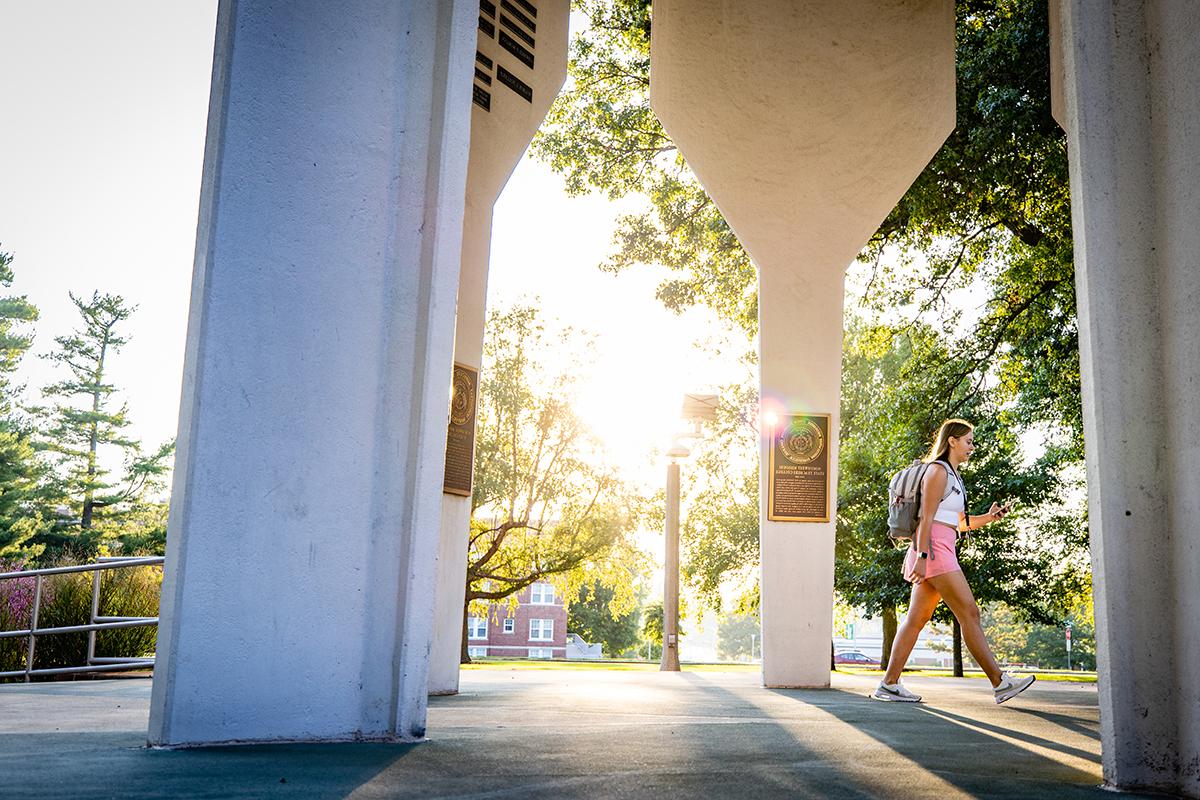 A Northwest students crosses through the Memorial Bell Tower. (Photo by Todd Weddle/Northwest Missouri State University)